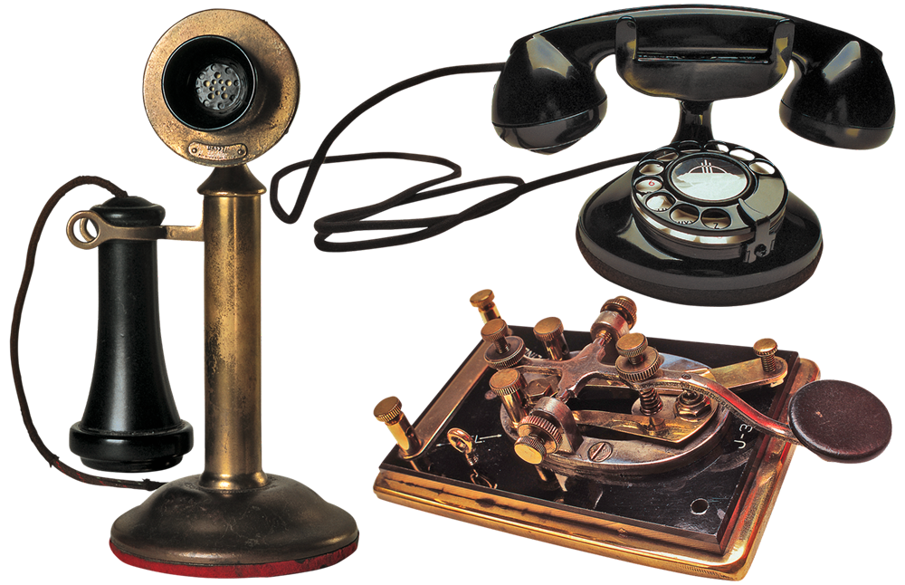 Old fashioned telephones and a telegraph machine for communication