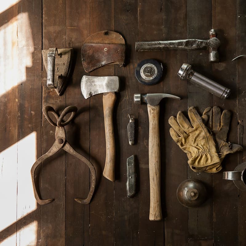 Dusty carpentry tools used to build on wood floor